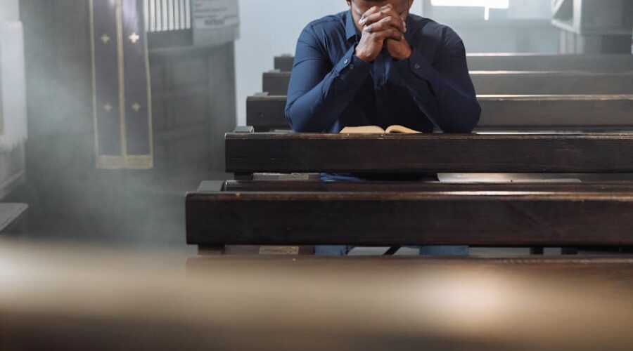 prayer sitting on bench in church