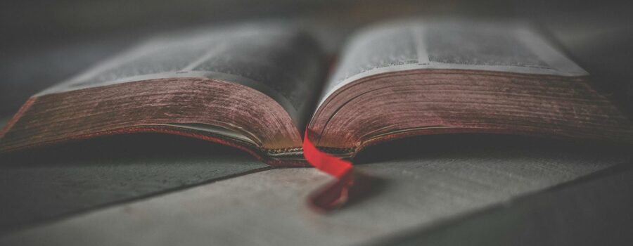 close up photo of an opened religious book