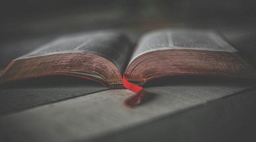 close up photo of an opened religious book