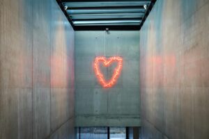 neon heart in modern architectural space