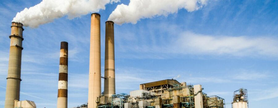 photo of an industrial factory emitting smoke