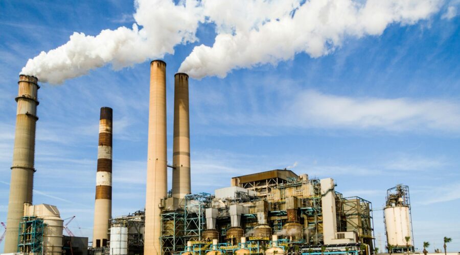 photo of an industrial factory emitting smoke