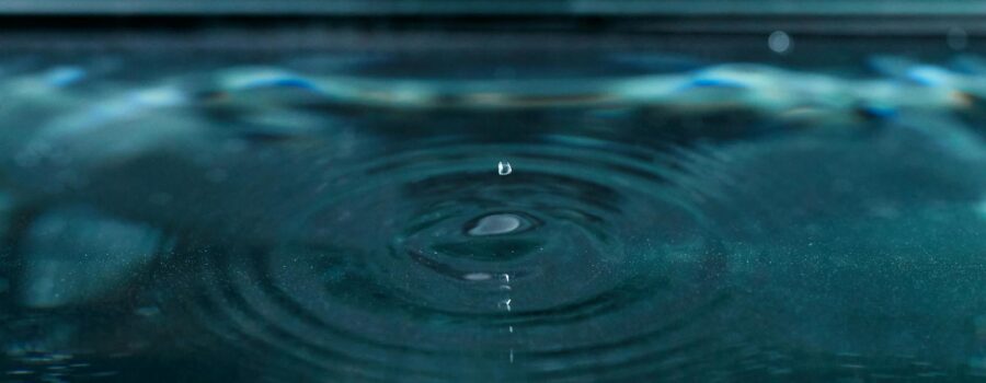 a water drop on the surface of the water