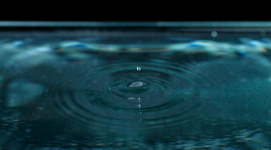 a water drop on the surface of the water